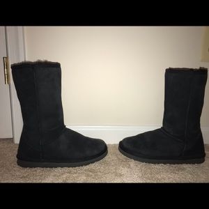 Tall black UGG boots